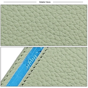 Detail view of light green lychee grain leather wallet with neat white stitching