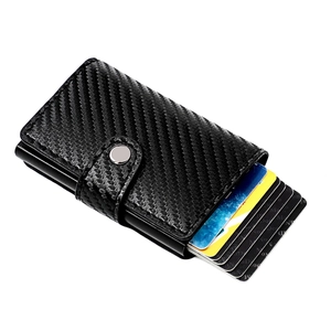 Detail of RFID carbon fiber wallet showing the automatic pop-up mechanism for credit cards