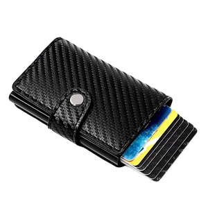 Detail of RFID carbon fiber wallet with pop-up mechanism and metal snap closure