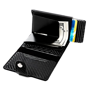 Detail of RFID carbon fiber wallet showing pop-up card mechanism and cash compartment