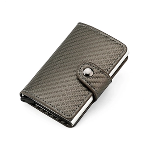Detail of RFID aluminum card holder with carbon fiber texture and snap closure
