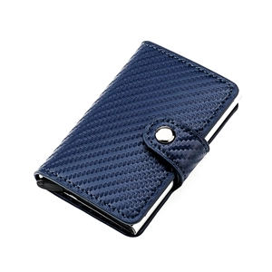 Close-up of navy blue carbon fiber texture and automatic metal card ejection button