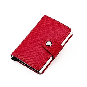 Detail of red carbon fiber RFID wallet featuring a metal buckle and pop-up card mechanism