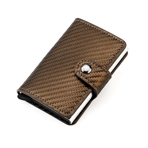 Detail of brown carbon fiber texture card holder with metal RFID pop-up mechanism