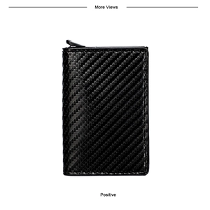 Detailed view of black carbon fiber texture and push-button mechanism on aluminum wallet