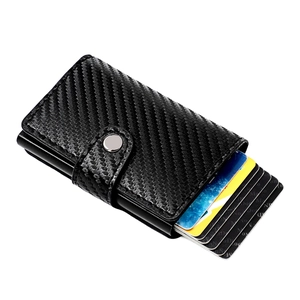 Carbon fiber RFID wallet with aluminum pop-up card holder and secure snap closure