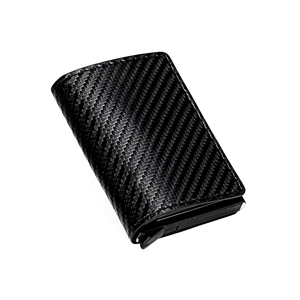 Slim black carbon fiber wallet for men with pop-up card mechanism and textured finish