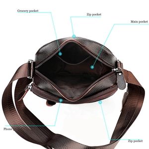 Macro shot showing internal compartments and storage capacity of dark brown leather bag