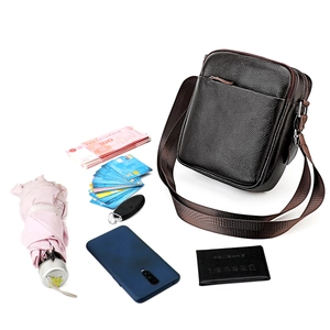 Top-down view of black pebble leather crossbody bag with spacious interior for daily items