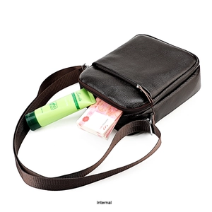 Internal view of dark brown pebbled leather shoulder bag showing capacity and textures