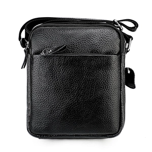 Close-up of black genuine leather messenger bag featuring pebble grain texture and zippers
