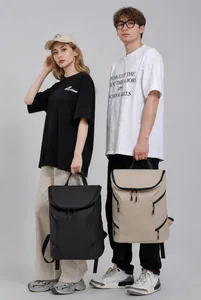 Front view of large capacity casual backpacks in black and beige for men and women