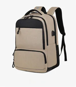 Detail view of khaki and black business backpack with USB port and multiple pockets