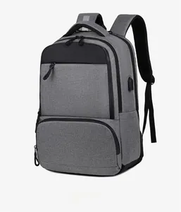 Detailed side view of grey business laptop backpack with integrated USB charging port