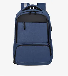Detail of navy blue business backpack showing dual zippers and external USB charging port