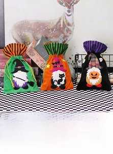 Detailed view of velvet Halloween drawstring bags with gnome, pumpkin and black cat motifs