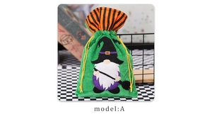 Detail of green velvet Halloween drawstring bag with wizard gnome and broom embroidery