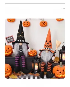Detail of two Halloween gnomes with witch hats, broom and Happy Halloween sign