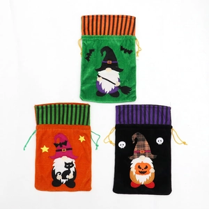 Three Halloween velvet drawstring bags with cartoon gnome, pumpkin and black cat designs
