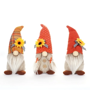 Three autumn harvest festival gnomes with sunflowers and plaid bows for home decoration