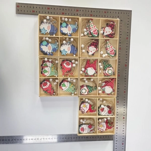 Macro view of Christmas gnome wooden pendants with hanging ropes in a divided wood tray