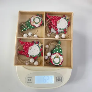 Christmas wooden gnome ornaments set in box weighing 62 grams on a digital scale