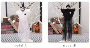 Detail of Halloween witch and ghost dolls featuring long tulle skirts and pointed hats