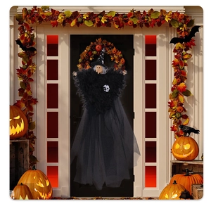 Close-up of hanging witch decoration with black star hat and skull in spooky setting