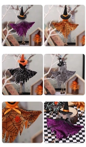 Detailed view of Halloween ghost and witch hanging dolls with spider web texture