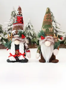 Detail of Christmas gnomes with knit hats, white braids, and wooden ski poles on snow