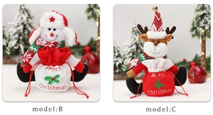 Detail view of knitted Christmas gift bags with snowman and reindeer character designs
