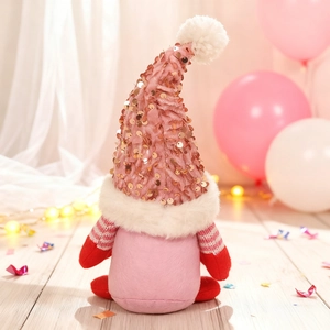 Detailed view of a pink Valentine's gnome doll with sequined hat and striped arms