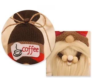Detail view of coffee gnome with knitted hat, burlap bow, coffee beans and miniature cup