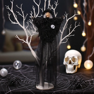 Halloween witch hanging decoration with black tulle skirt and miniature skull accessory