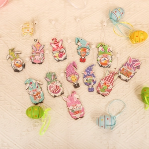 12-piece set of wooden Easter gnome ornaments with rabbit ears and colorful painted details
