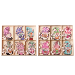 Easter wooden gnome pendants set with rabbit ears and colorful eggs in storage boxes