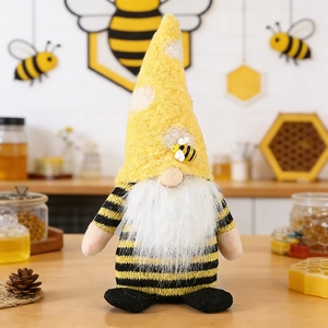 Detail of bee festival gnome with yellow pointed hat and striped body in cozy home setting