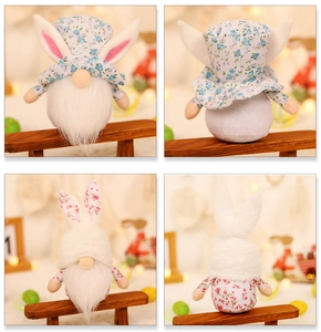 Detail view of rustic Easter gnome dolls with floral rabbit ears for desktop decor