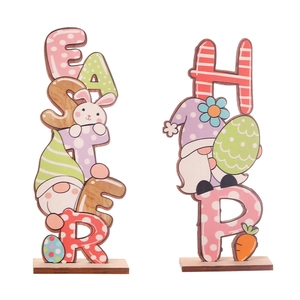Easter gnome wooden table decor featuring colorful letters and cartoon rabbit figurines