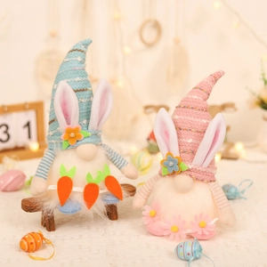 Set of two glowing Easter bunny gnomes with carrot accents and warm LED lights decor