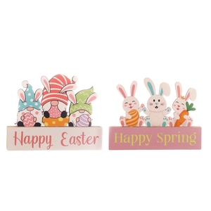 Easter decorative wooden gnome and rabbit figurines with Happy Easter and Spring text