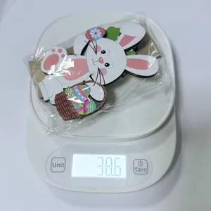 Detailed weight measurement showing 38.6g for a wooden Easter bunny craft ornament