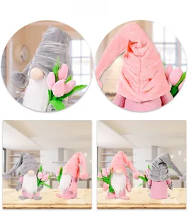 Detail of plush gnome dolls featuring knitted hats and pink tulip bouquets for Mother's Day
