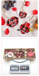 Detail of wooden Valentine heart gnomes ornaments with red black buffalo plaid pattern