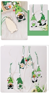 Close-up of wooden St. Patrick's Day gnome ornaments hanging on a white branch