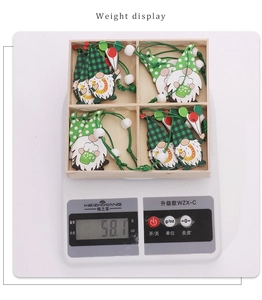 Weight display of St. Patrick's Day wooden gnome ornaments set in a wooden box