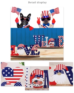 Detail view of wooden USA Independence Day decor featuring LOVE and WELCOME signs