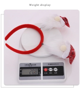 Christmas forest gnome headband weighing 20.8g on an electronic scale for size check