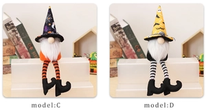 Detail of Halloween gnome figurines with striped long legs and spider web pointed hats