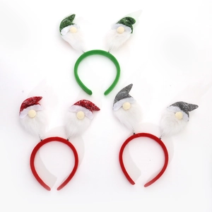 Three Christmas gnome headbands with glitter hats and bouncy springs on white background